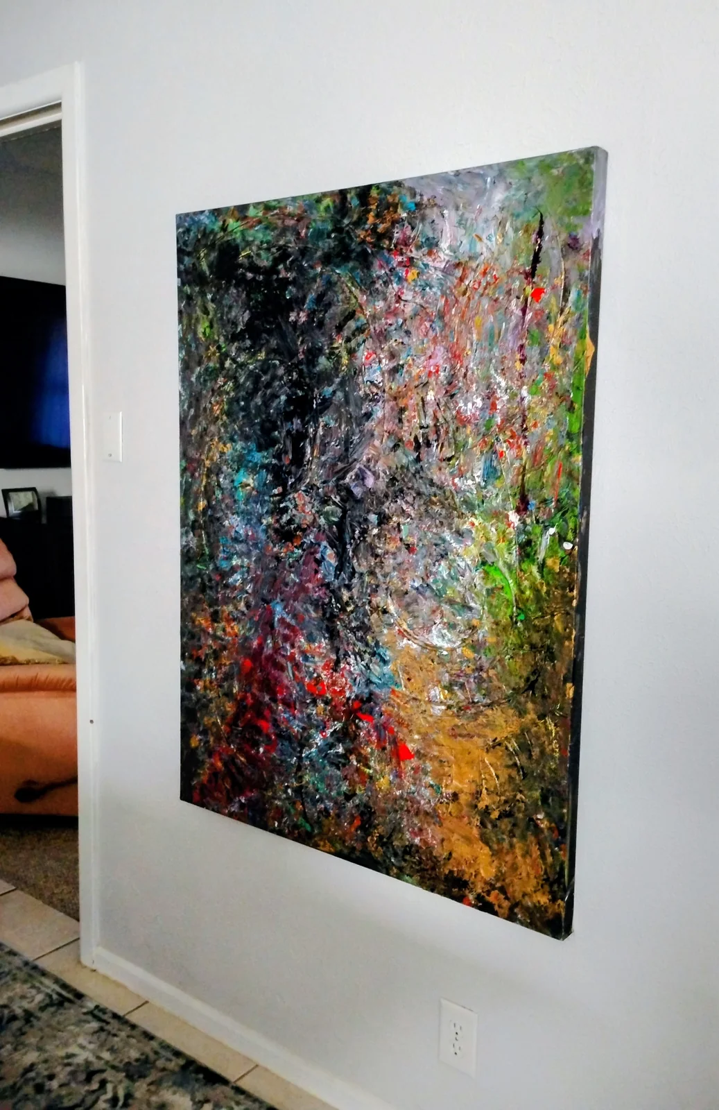 Visions hanging on a real wall, photographed at an angle.